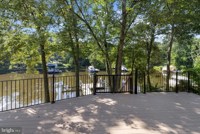 an empty room with closet and fan