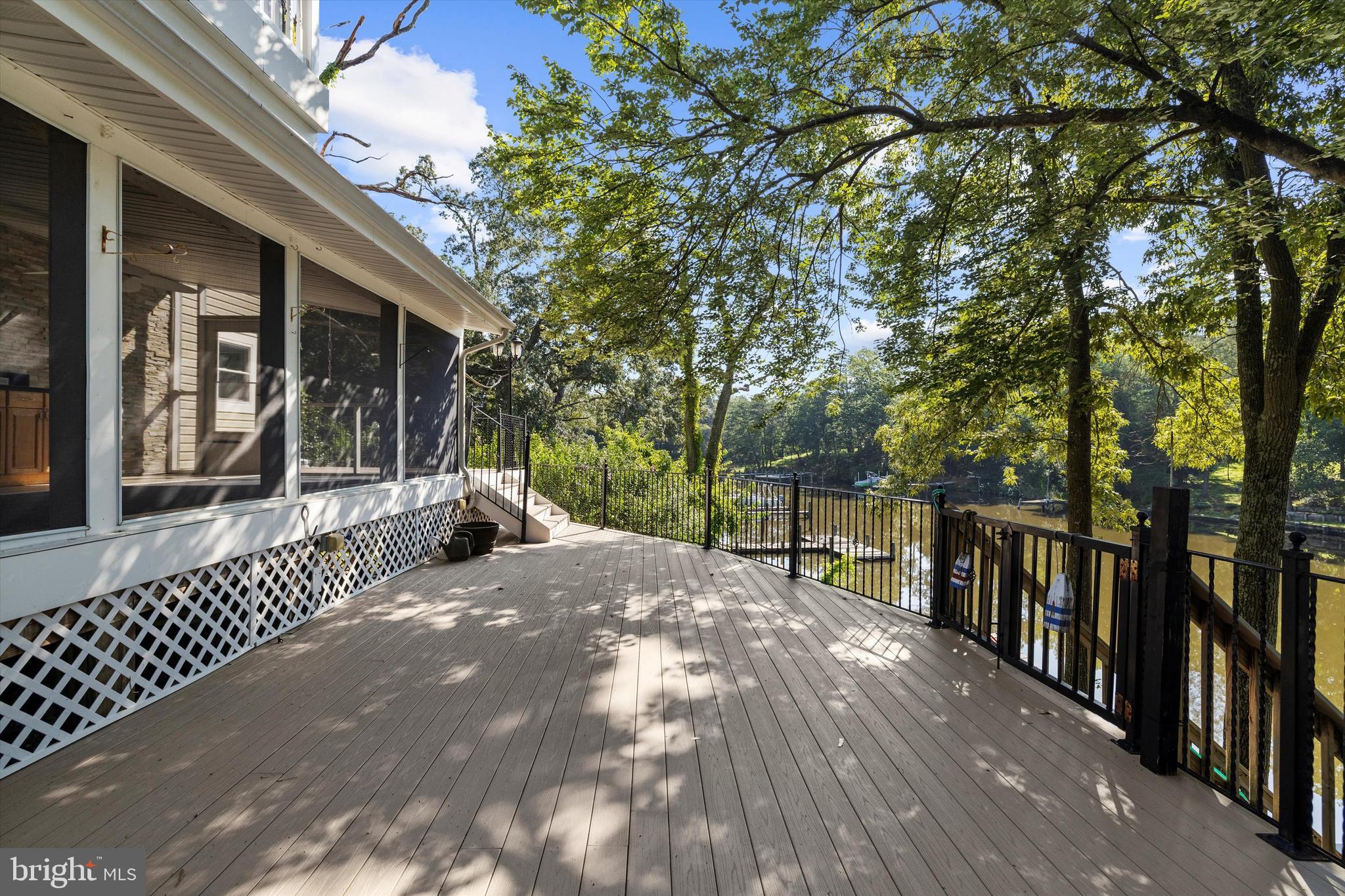 619 Riverside Drive Pasadena, MD 21122 - Photo 26 of 84 a view of a house with backyard and sitting area