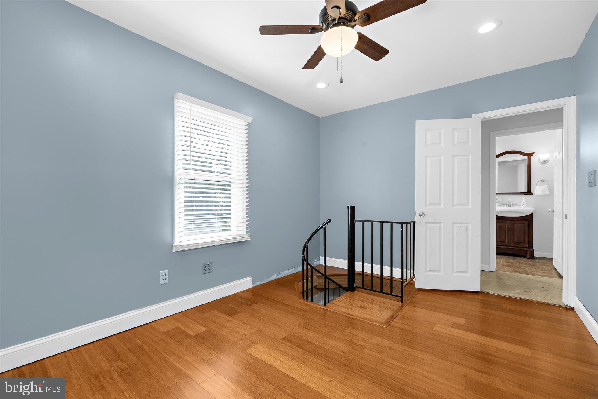 619 Riverside Drive Pasadena, MD 21122 - Photo 31 of 84 a view of an empty room with a window and wooden floor