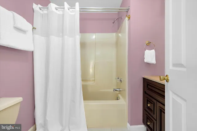 a view of a lake with boats and trees in the background