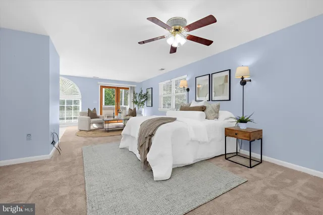 an aerial view of residential house with outdoor space and trees all around