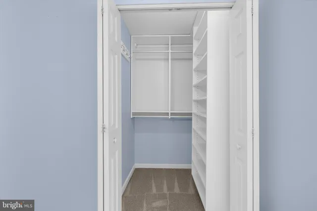 an aerial view of a house with garden space and swimming pool