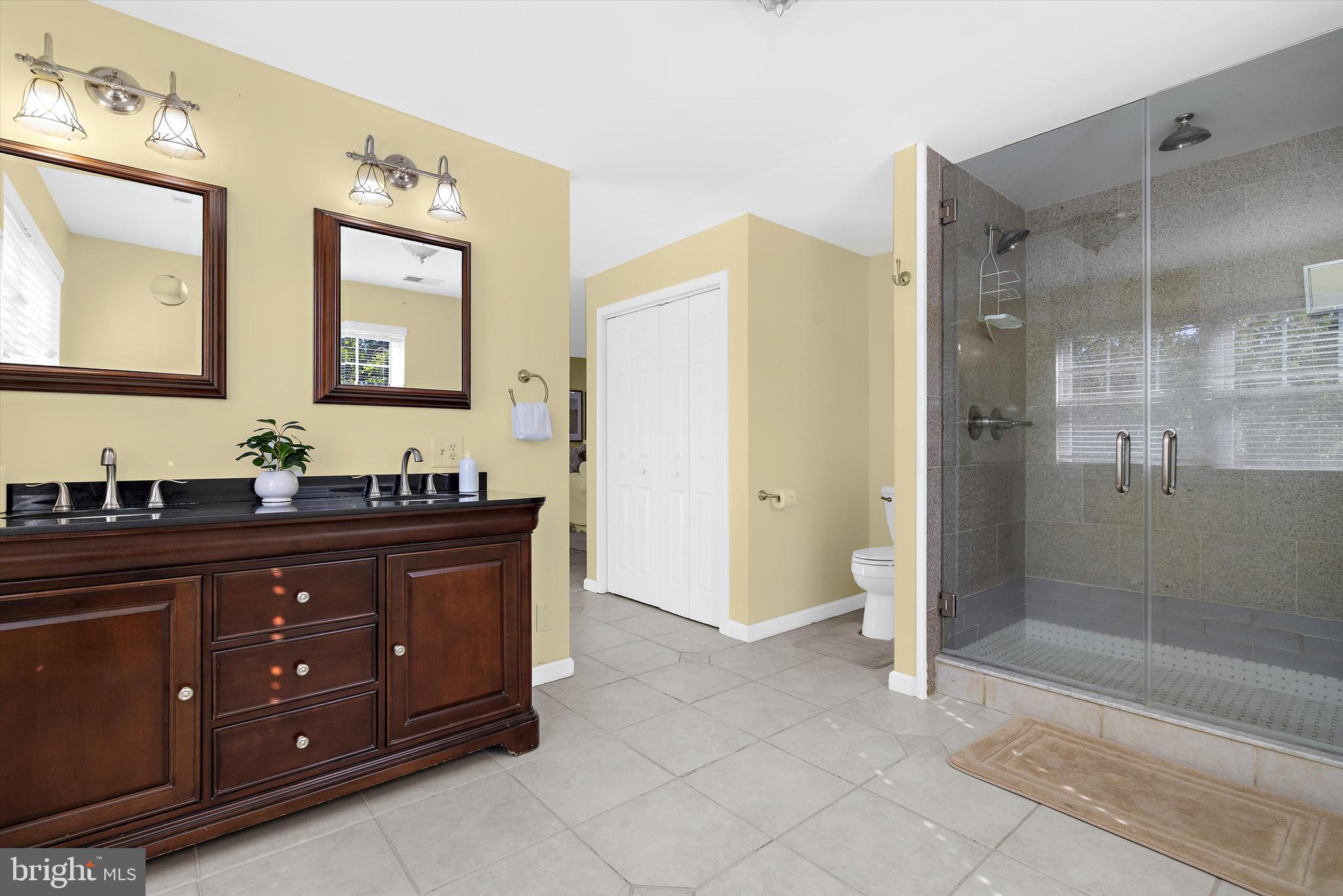 619 Riverside Drive Pasadena, MD 21122 - Photo 50 of 84 a spacious bathroom with a granite countertop sink mirror and shower