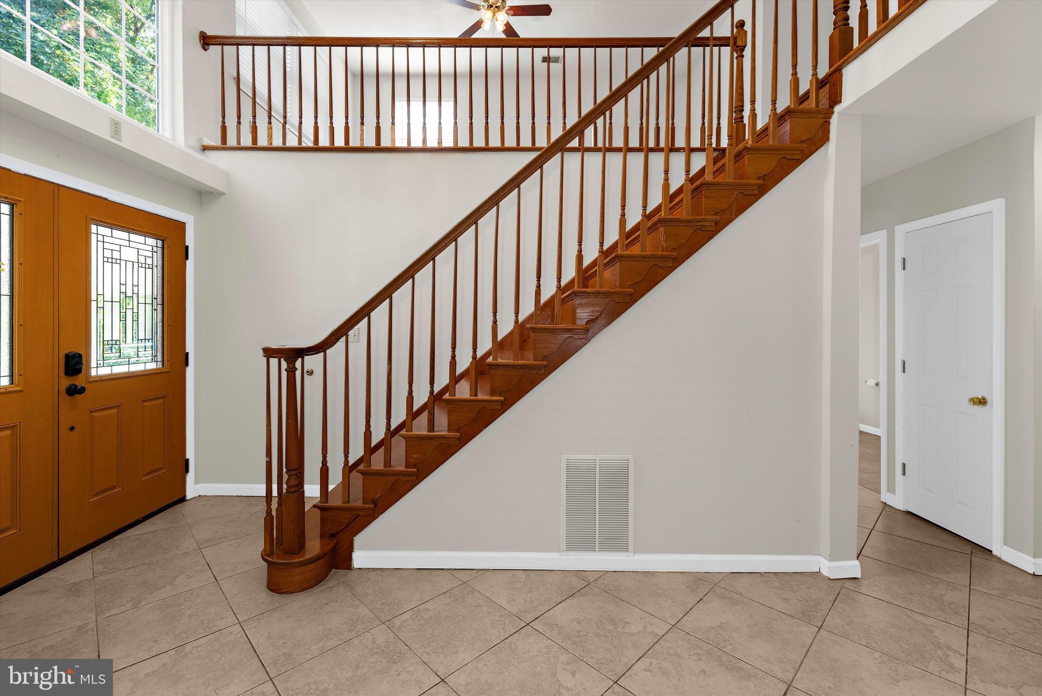 619 Riverside Drive Pasadena, MD 21122 - Photo 6 of 84 a view of staircase with railing and white walls