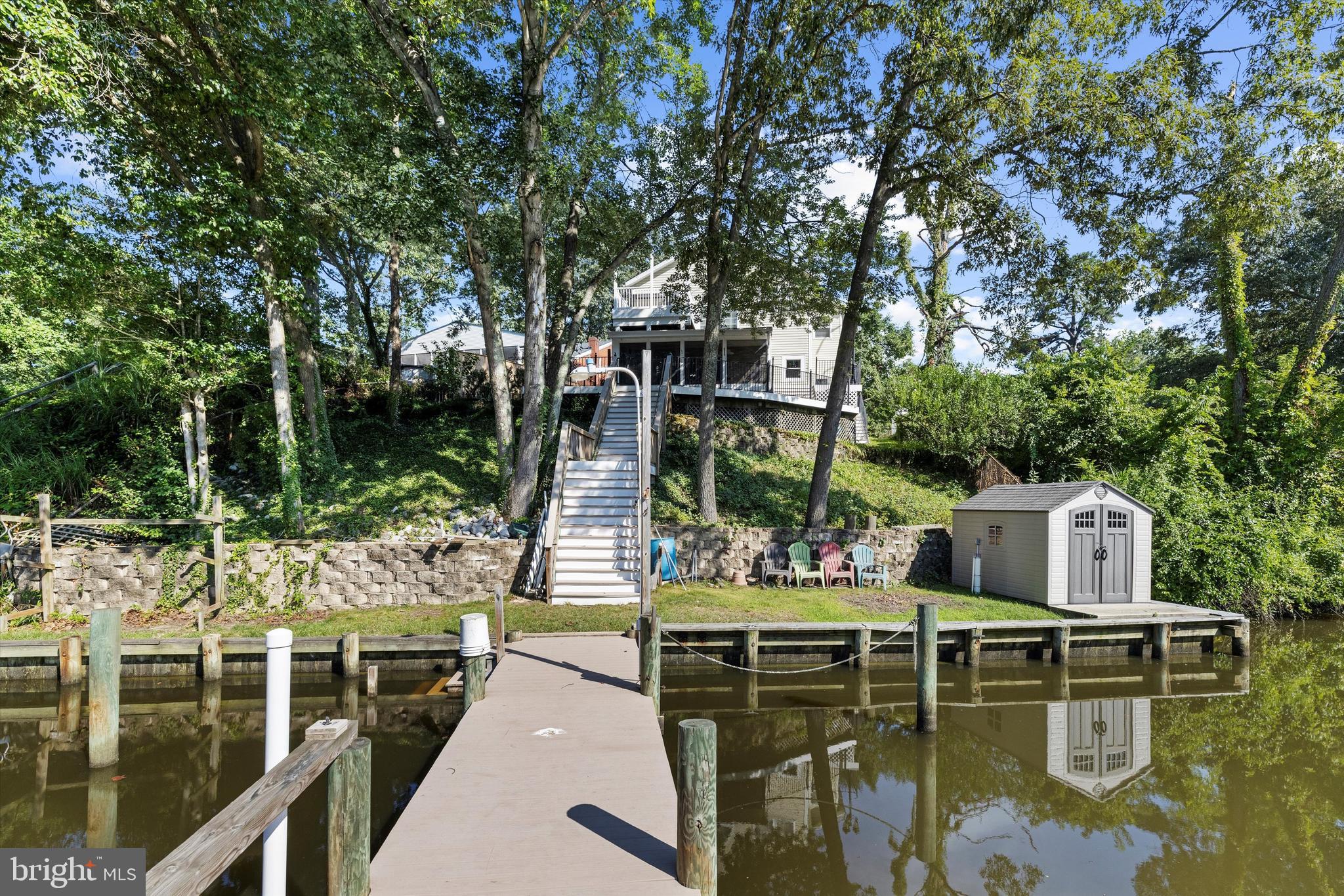 619 Riverside Drive Pasadena, MD 21122 - Photo 67 of 84 a view of house with swimming pool and sitting area