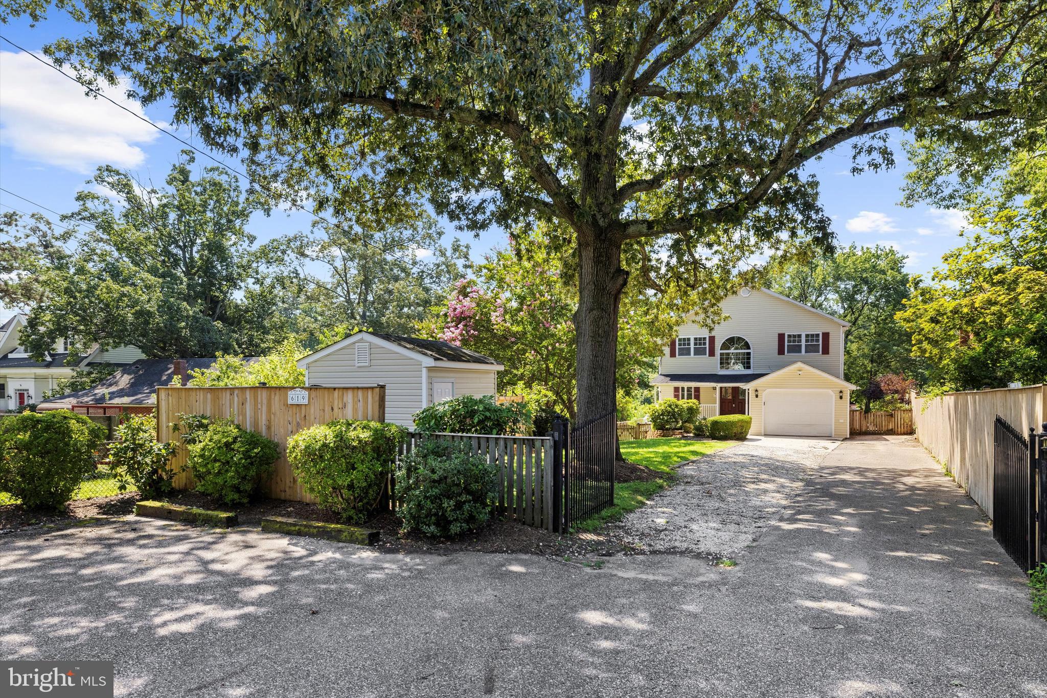 619 Riverside Drive Pasadena, MD 21122 - Photo 82 of 84 a view of a house with a tree in front of it