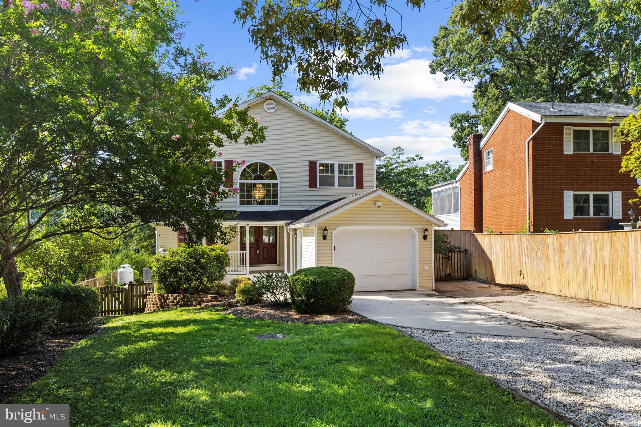 619 Riverside Drive Pasadena, MD 21122 - Photo 83 of 84 a view of a yard in front of a house with plants and large tree