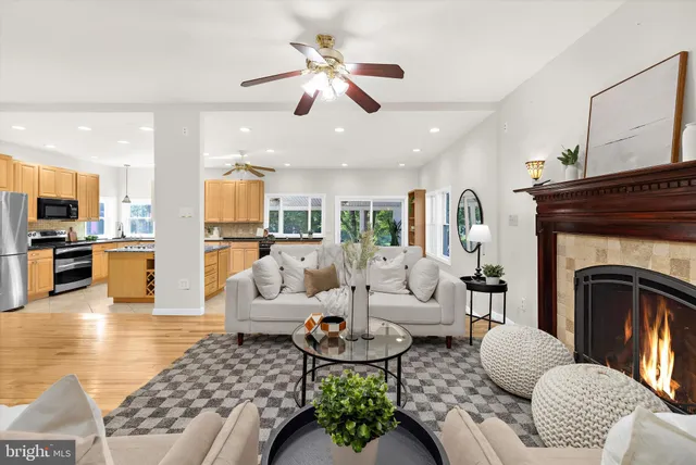 a living room with furniture and a fireplace