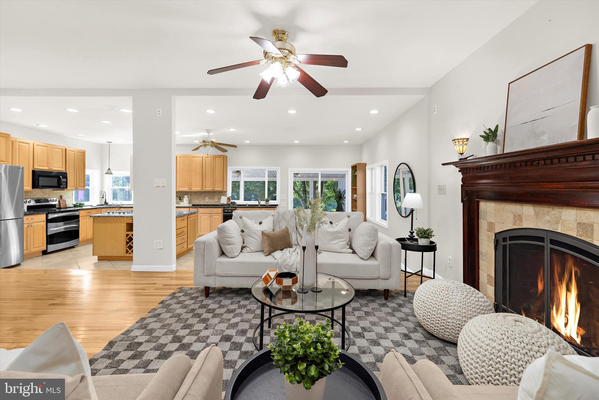 619 Riverside Drive Pasadena, MD 21122 - Photo 9 of 84 a living room with furniture kitchen view and a fireplace