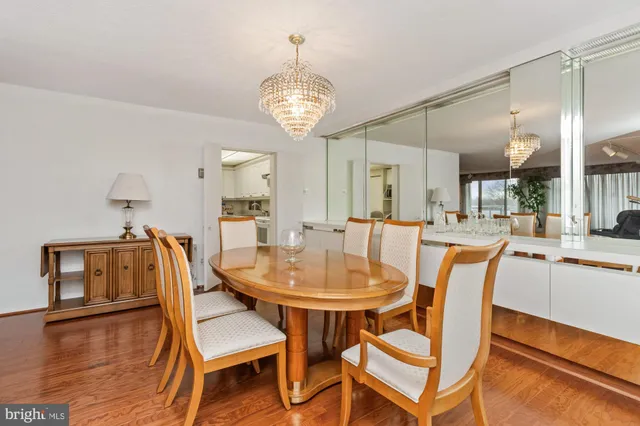a living room with fireplace furniture and a large window