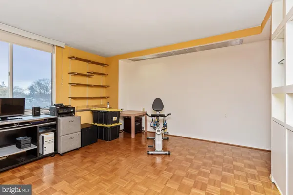 a view of a livingroom with furniture and a bathroom