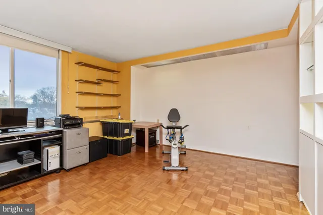 a view of a livingroom with furniture and a bathroom
