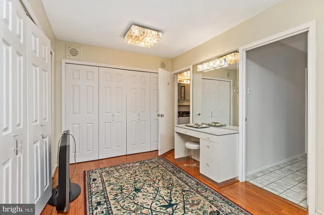 a bedroom with a bed and a table in it