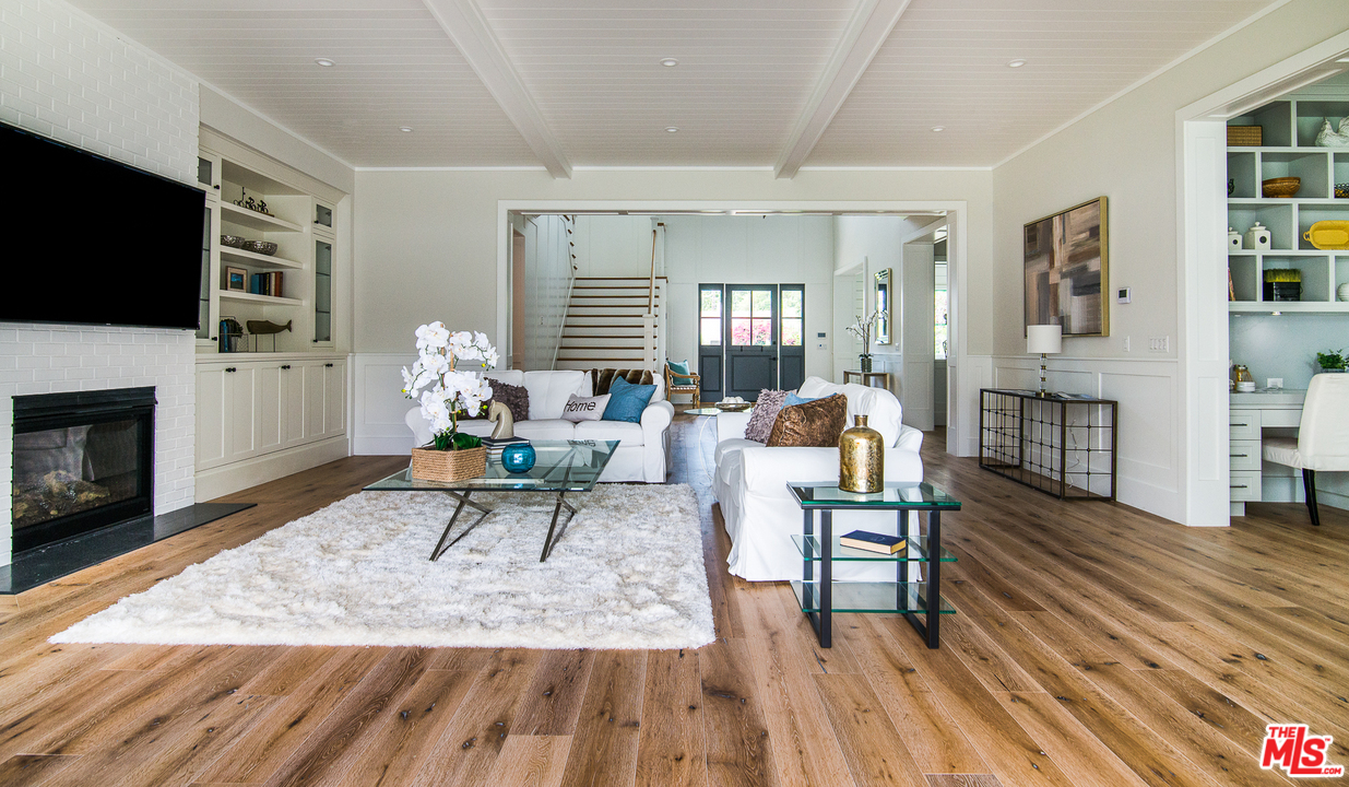 4425 Beck Avenue Studio City, CA 91602 - Photo 15 of 48 a living room with furniture a flat screen tv and a fireplace