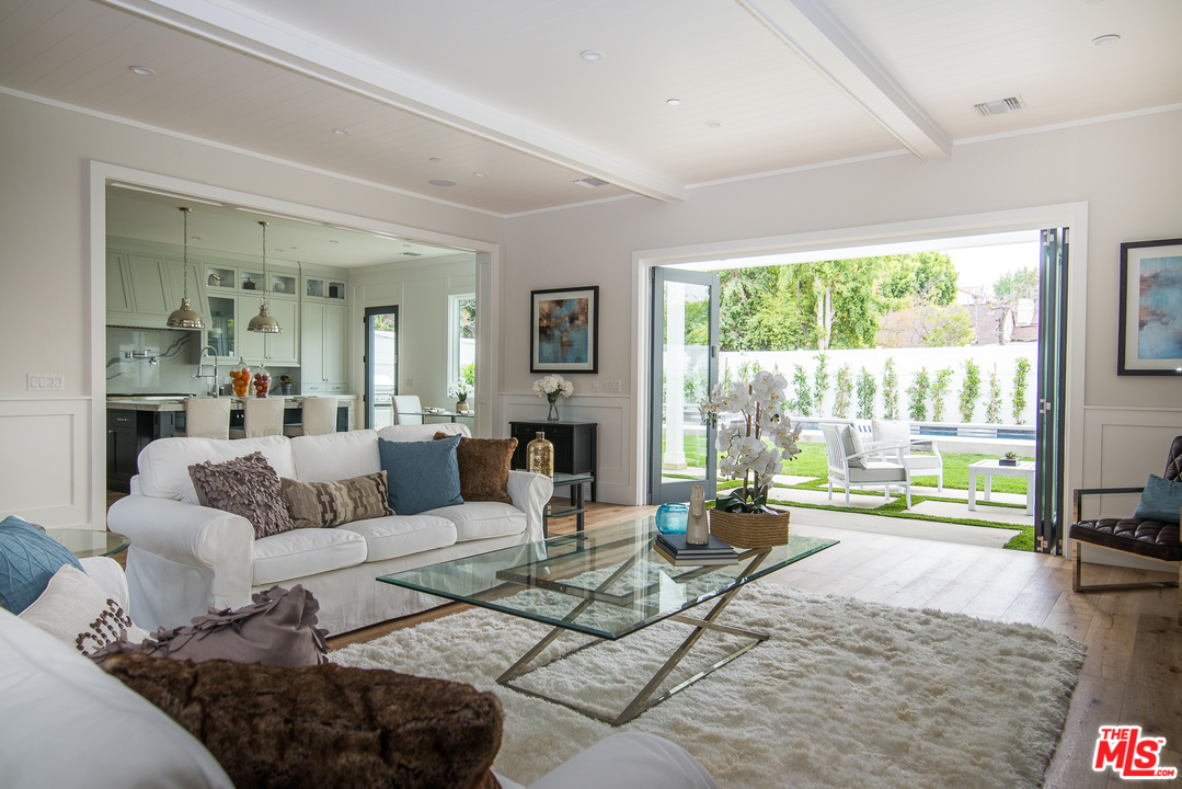 4425 Beck Avenue Studio City, CA 91602 - Photo 17 of 48 a living room with furniture floor to ceiling window and a table