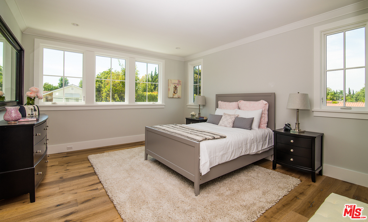 4425 Beck Avenue Studio City, CA 91602 - Photo 37 of 48 a white bed sitting in a bedroom next to a window