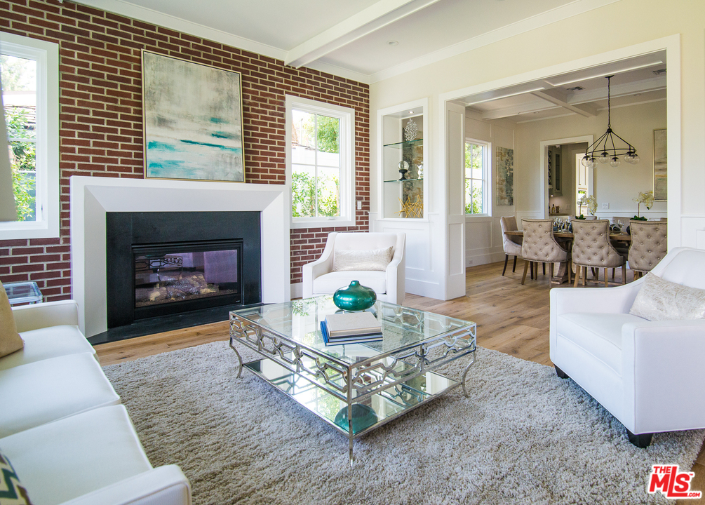 4425 Beck Avenue Studio City, CA 91602 - Photo 9 of 48 a living room with furniture a fireplace and a large window