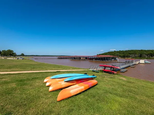 a view of a field with houses in outdoor space