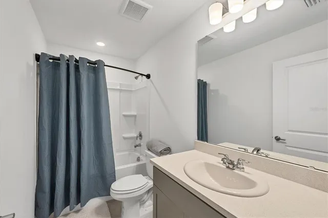 a bedroom with a bed and chair