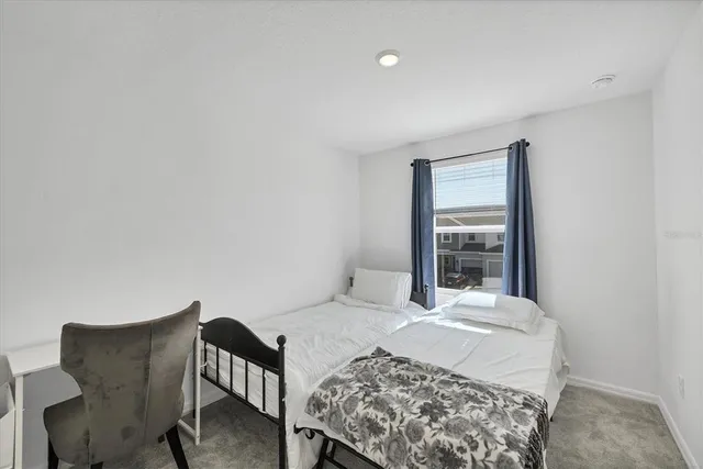 a bathroom with a sink and mirror with bathtub
