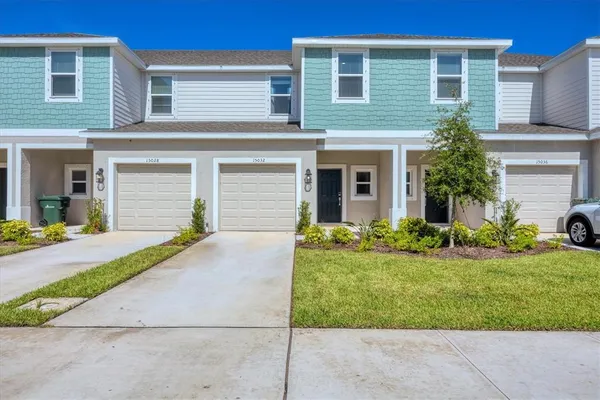 an aerial view of a swimming pool and outdoor seating