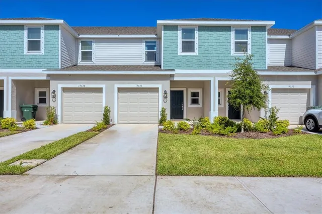 an aerial view of a swimming pool and outdoor seating