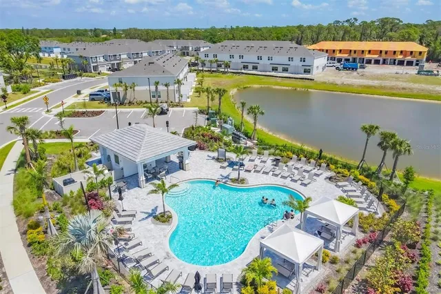 an aerial view of residential houses with outdoor space