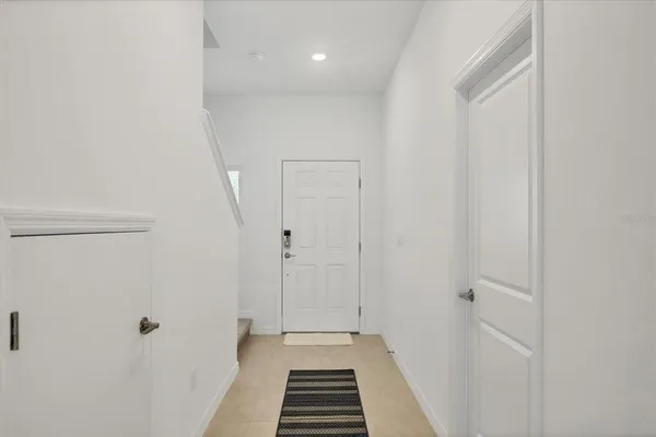 a kitchen with appliances a sink and cabinets
