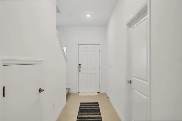 a kitchen with appliances a sink and cabinets