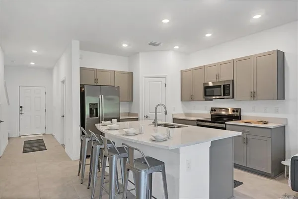 a living room with furniture a rug and a window