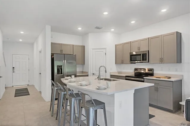 a living room with furniture a rug and a window