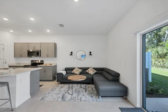 a kitchen that has a table and chairs in it