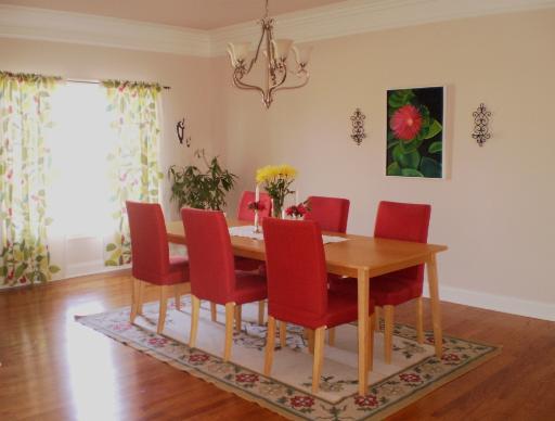 4208 Champion Road Naperville, IL 60564 - Photo 3 of 16 a view of a dining room with furniture a chandelier and wooden floor