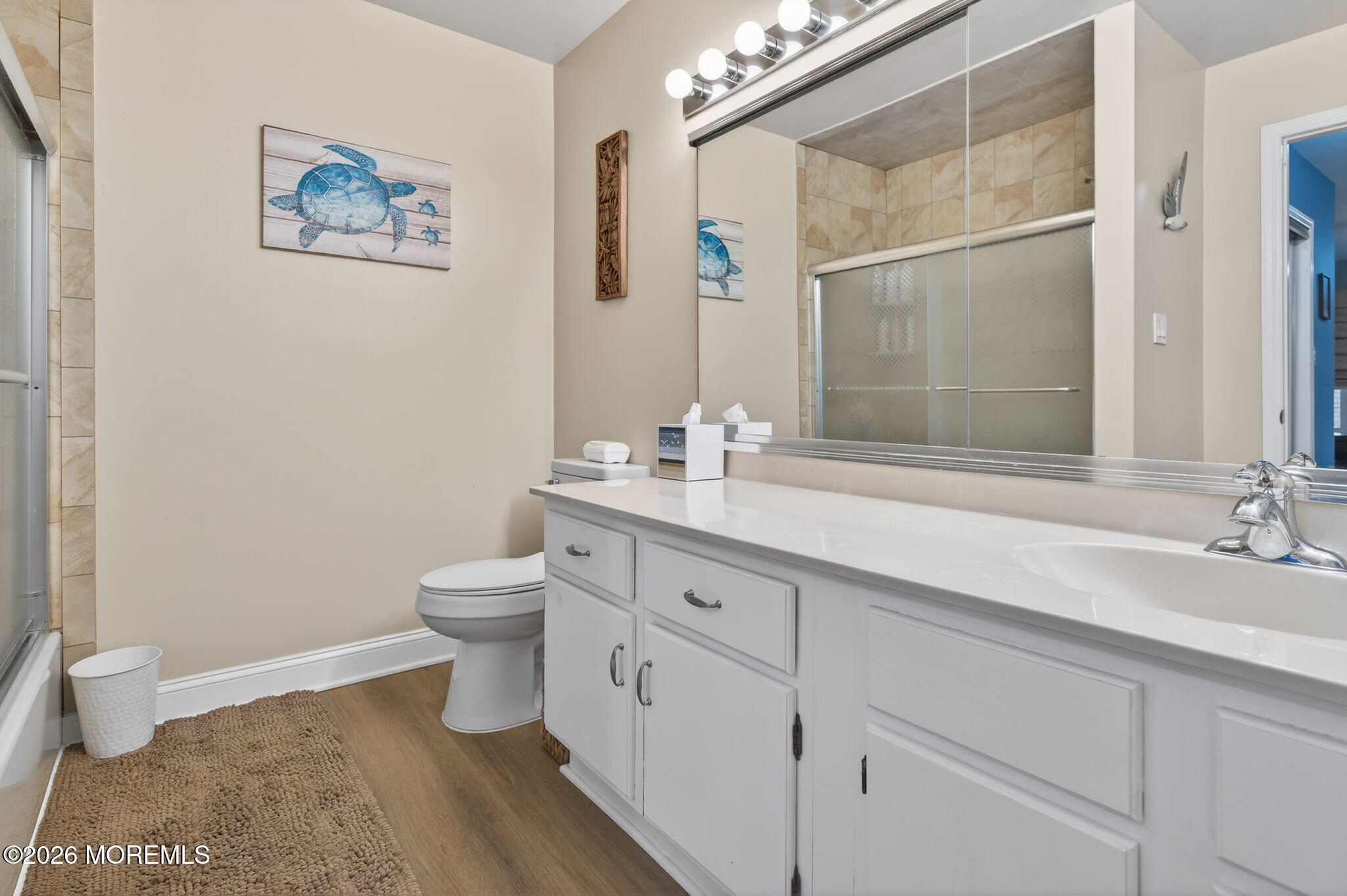 5 Scarborough Road, Unit D Monroe Township, NJ 08831 - Photo 13 of 28 a bathroom with a granite countertop sink a toilet and a mirror