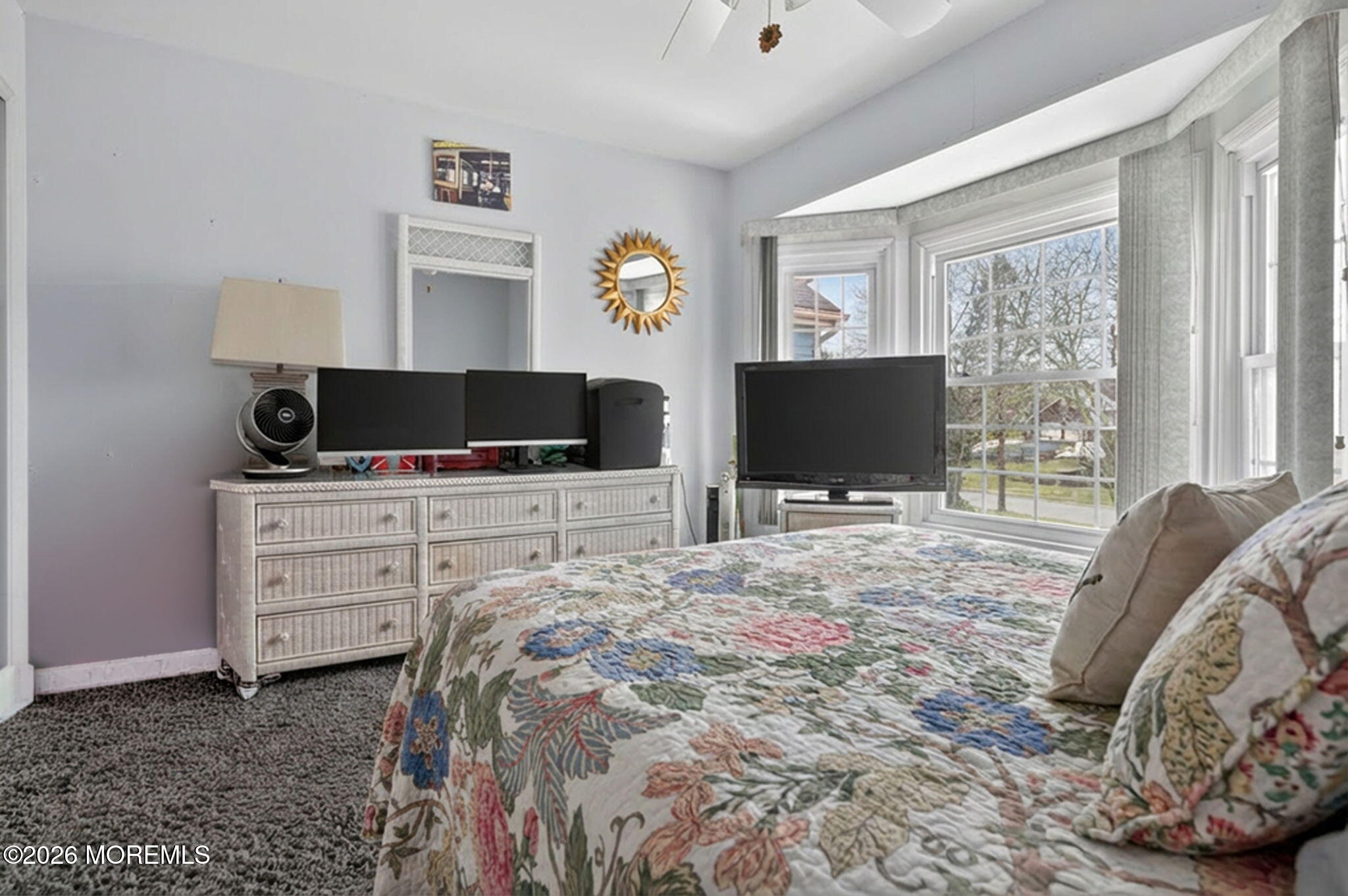 5 Scarborough Road, Unit D Monroe Township, NJ 08831 - Photo 16 of 28 a bedroom with a bed and flat screen tv