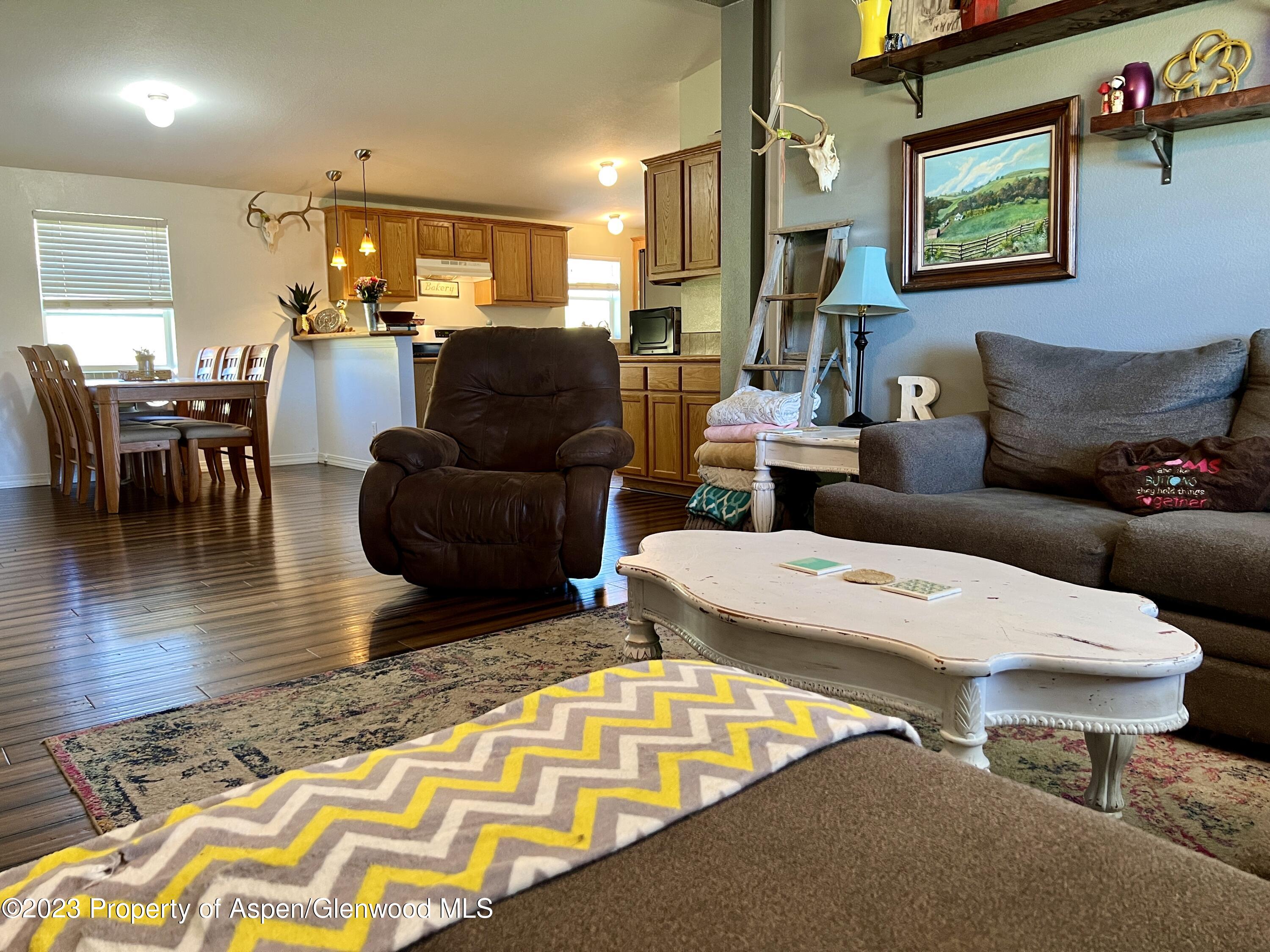 23105 A Highway Rifle, CO 81650 - Photo 3 of 28 a living room with furniture and a wooden floor