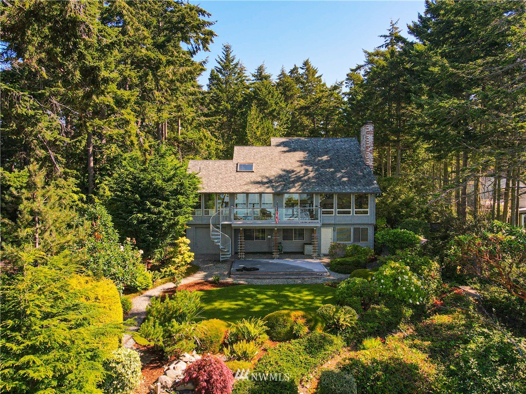 3115 Biz Point Road Anacortes, WA 98221 - Photo 2 of 39 front view of a house with a yard