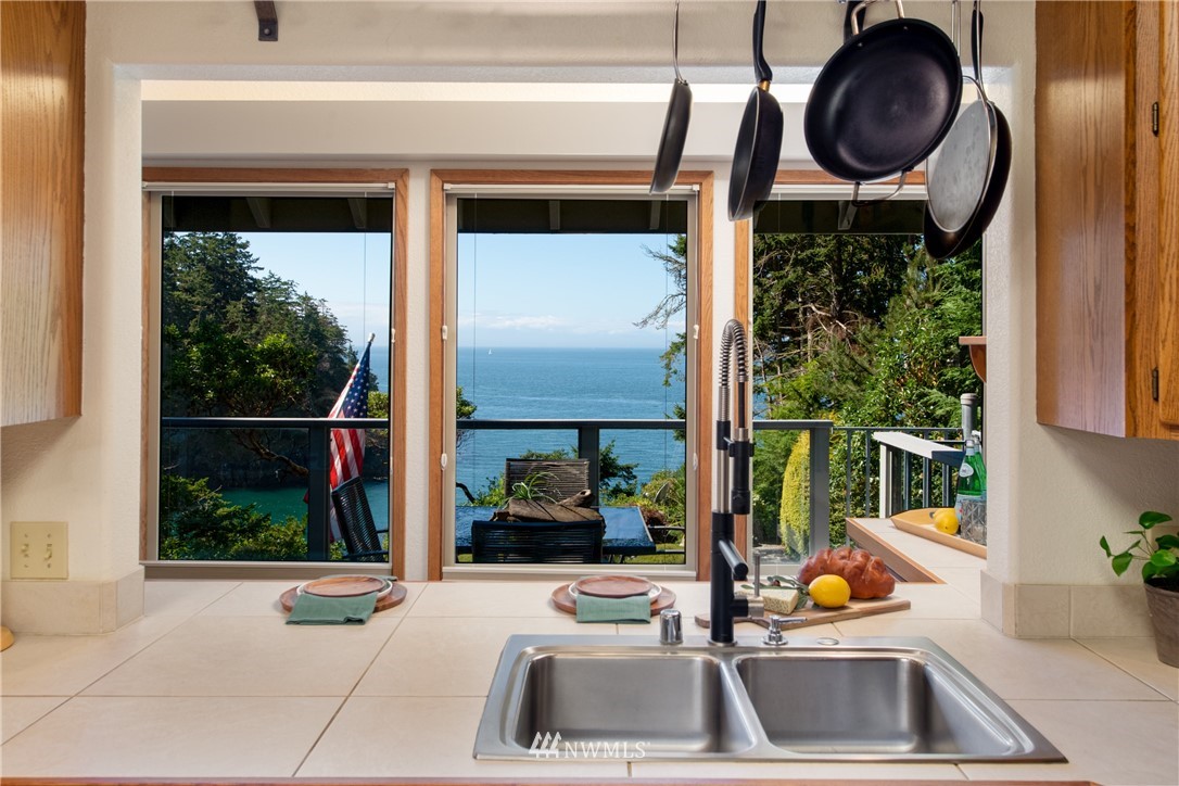 3115 Biz Point Road Anacortes, WA 98221 - Photo 12 of 39 a kitchen with a sink and a window