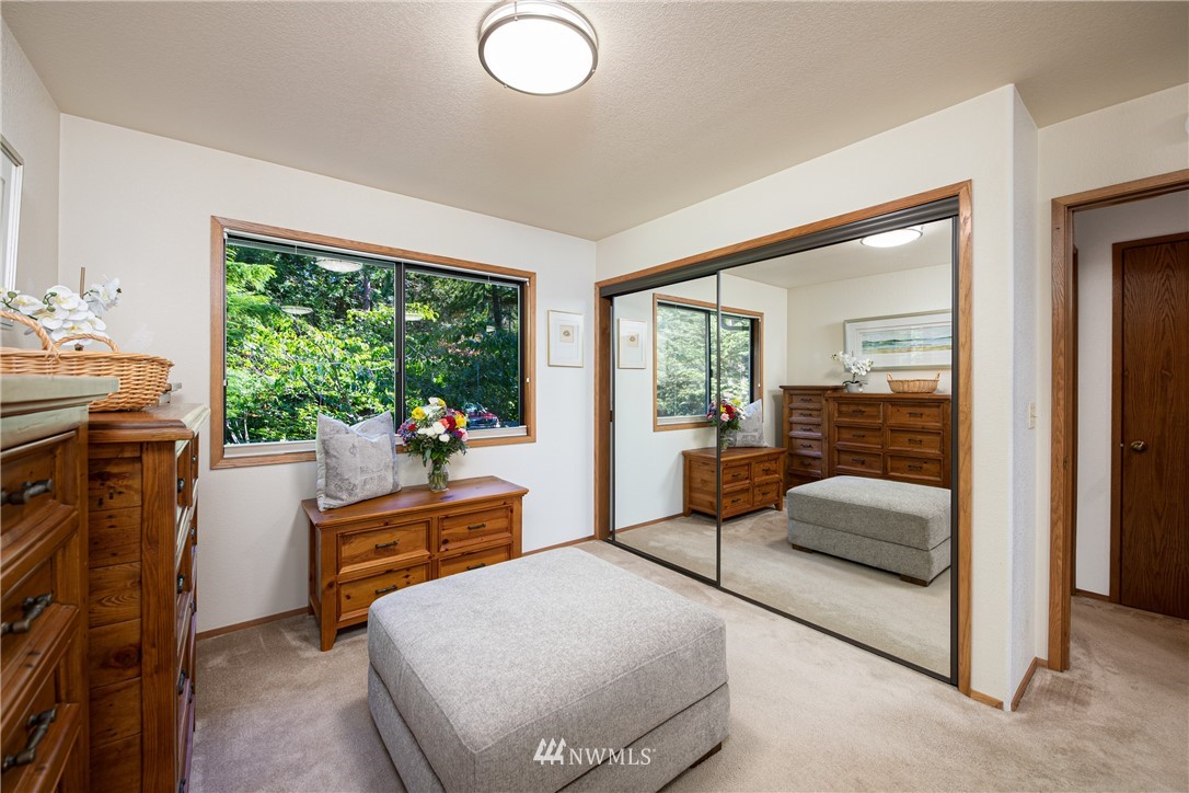 3115 Biz Point Road Anacortes, WA 98221 - Photo 16 of 39 a living room with furniture and a floor to ceiling window