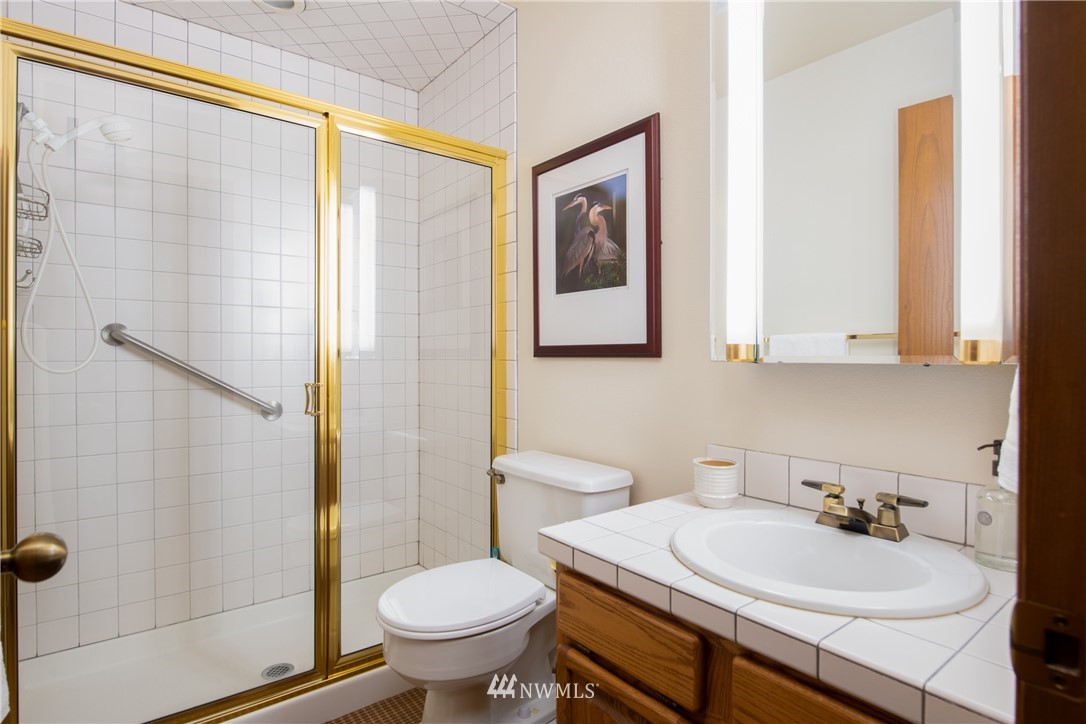 3115 Biz Point Road Anacortes, WA 98221 - Photo 23 of 39 a bathroom with a sink toilet and shower