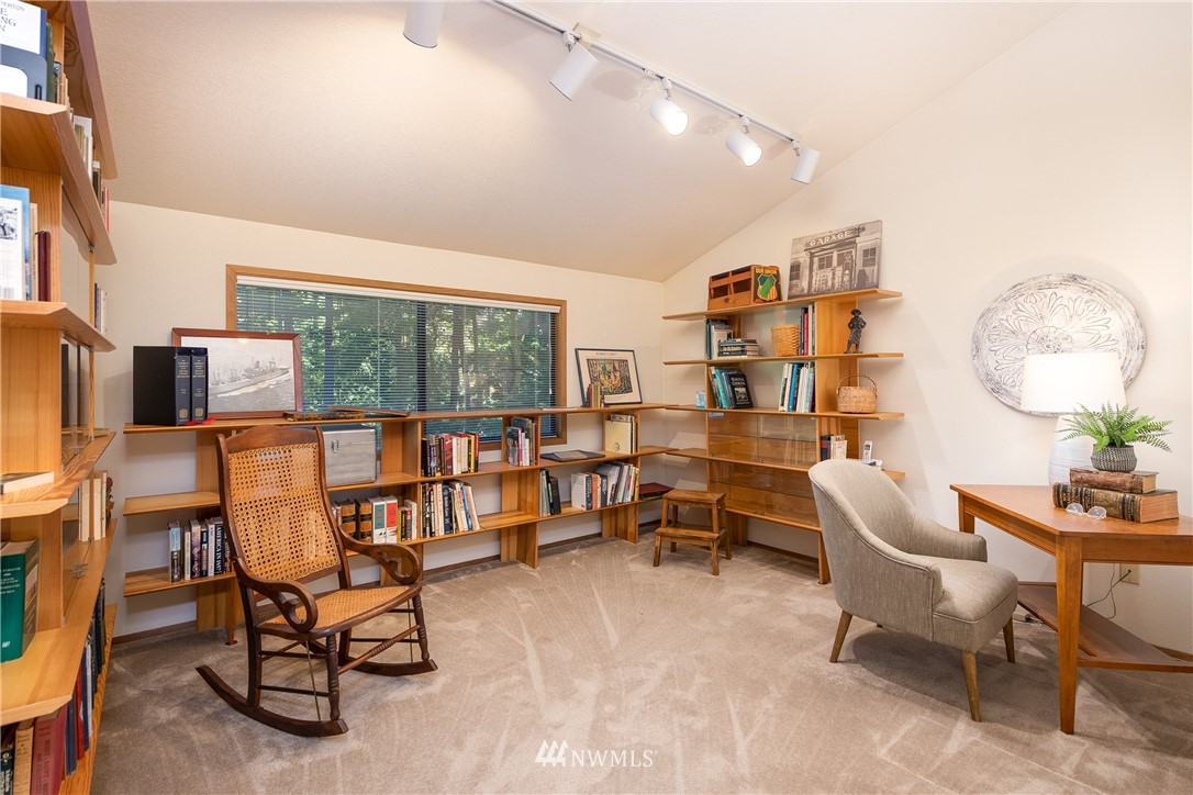3115 Biz Point Road Anacortes, WA 98221 - Photo 25 of 39 a living room with furniture and a floor to ceiling window