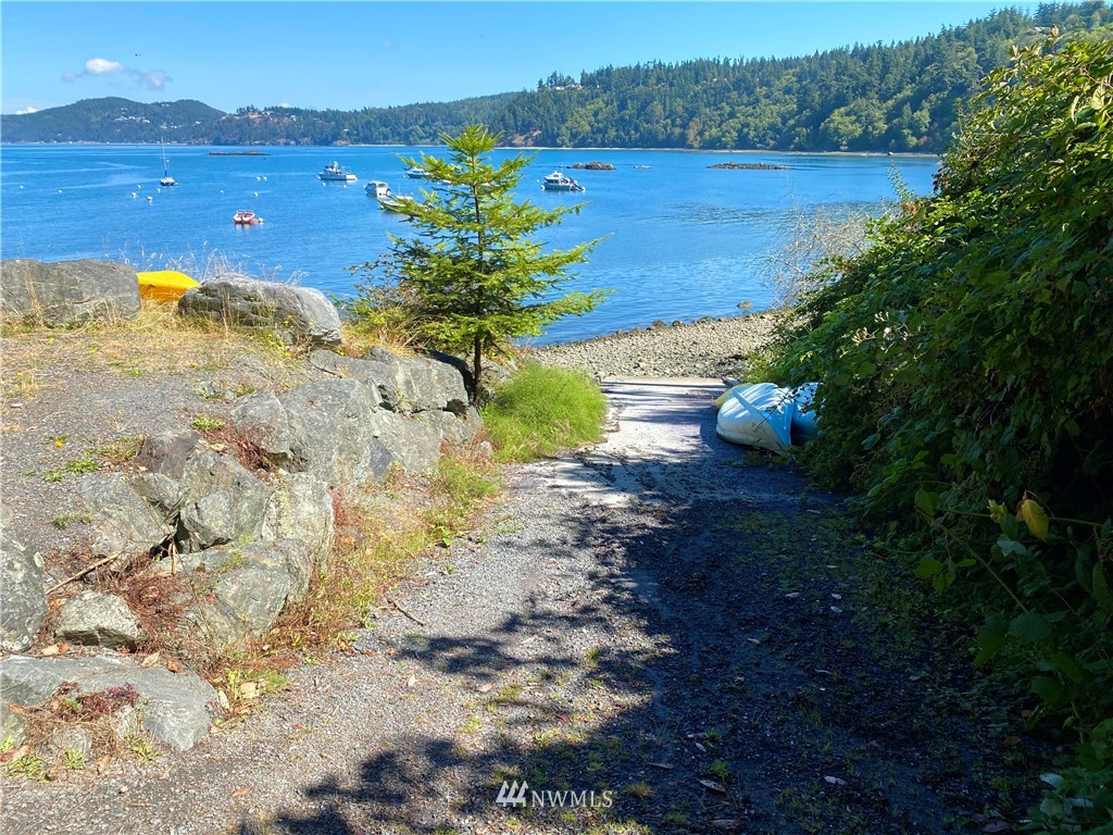 3115 Biz Point Road Anacortes, WA 98221 - Photo 36 of 39 a view of a lake with a mountain