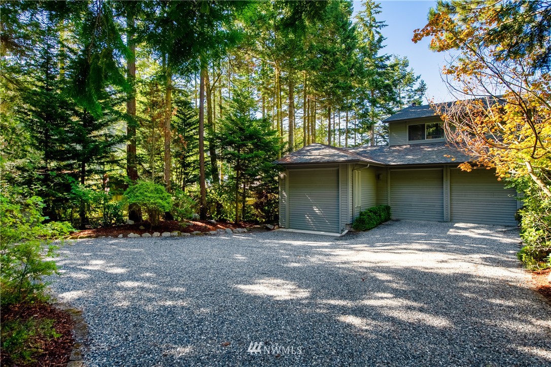 3115 Biz Point Road Anacortes, WA 98221 - Photo 38 of 39 a view of a house with a tree and a yard