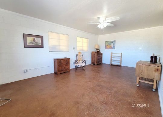 1549 South Gordon Street Ridgecrest, CA 93555 - Photo 14 of 44 a living room with furniture and a chandelier