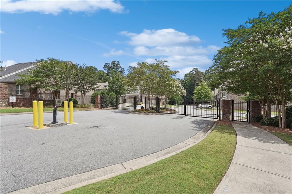 5590 Bright Cross Way Suwanee, GA 30024 - Photo 17 of 17 a view of a swimming pool with a patio