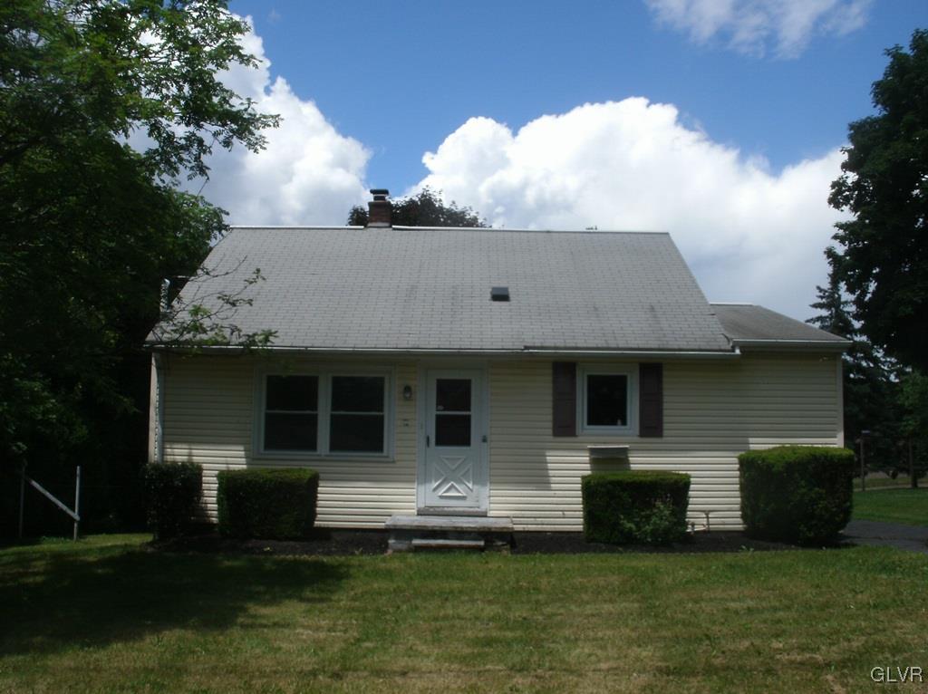 174 East County Road Drums, PA 18222 - Photo 1 of 12 a front view of a house with a garden