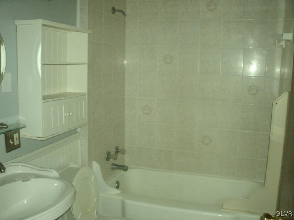 174 East County Road Drums, PA 18222 - Photo 10 of 12 a bath tub sitting next to a white toilet and sink