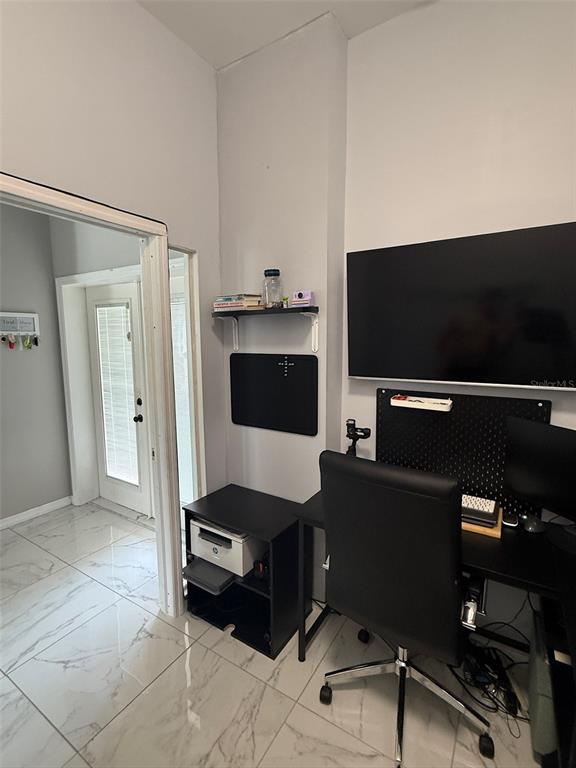 5690 Merlin Way St. Cloud, FL 34772 - Photo 14 of 46 a living room with furniture and a flat screen tv