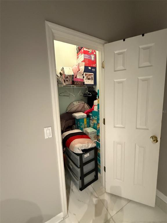 5690 Merlin Way St. Cloud, FL 34772 - Photo 29 of 46 a room with lot of flowers and closet