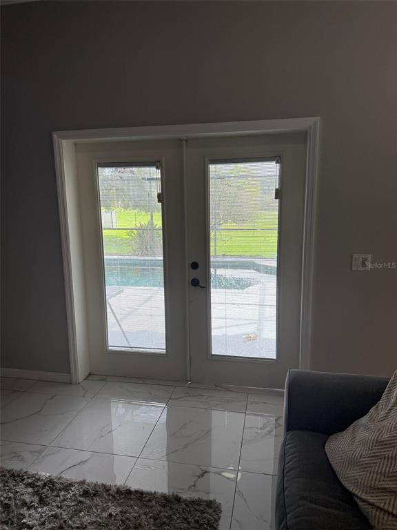 5690 Merlin Way St. Cloud, FL 34772 - Photo 35 of 46 a view of an empty room with a window